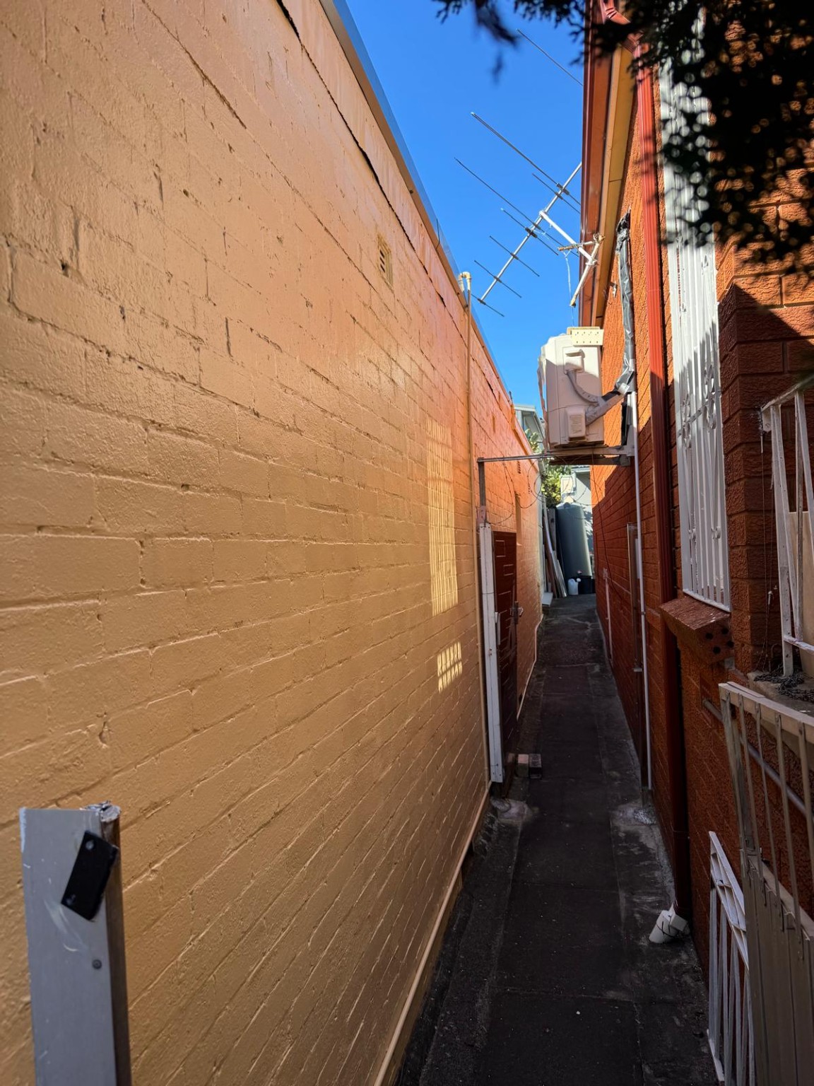 Exterior wall with peeling paint before maintenance